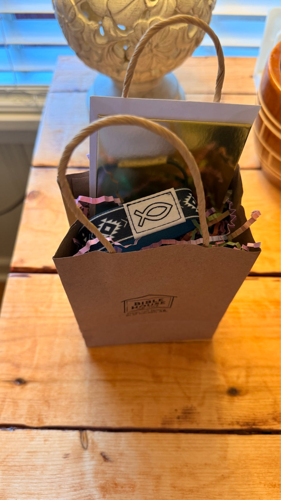 Bible House Goods gift-ready stamped kraft sack with a Bible Band and gift tag